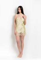 Discover the 2026 Summer collection of lingerie couture from the house Carine Gilson with this slip babydoll style straight neckline in light yellow silk with acid yellow lace