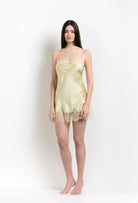 Discover the 2026 Summer collection of lingerie couture from the house Carine Gilson with this slip babydoll style straight neckline in light yellow silk with acid yellow lace