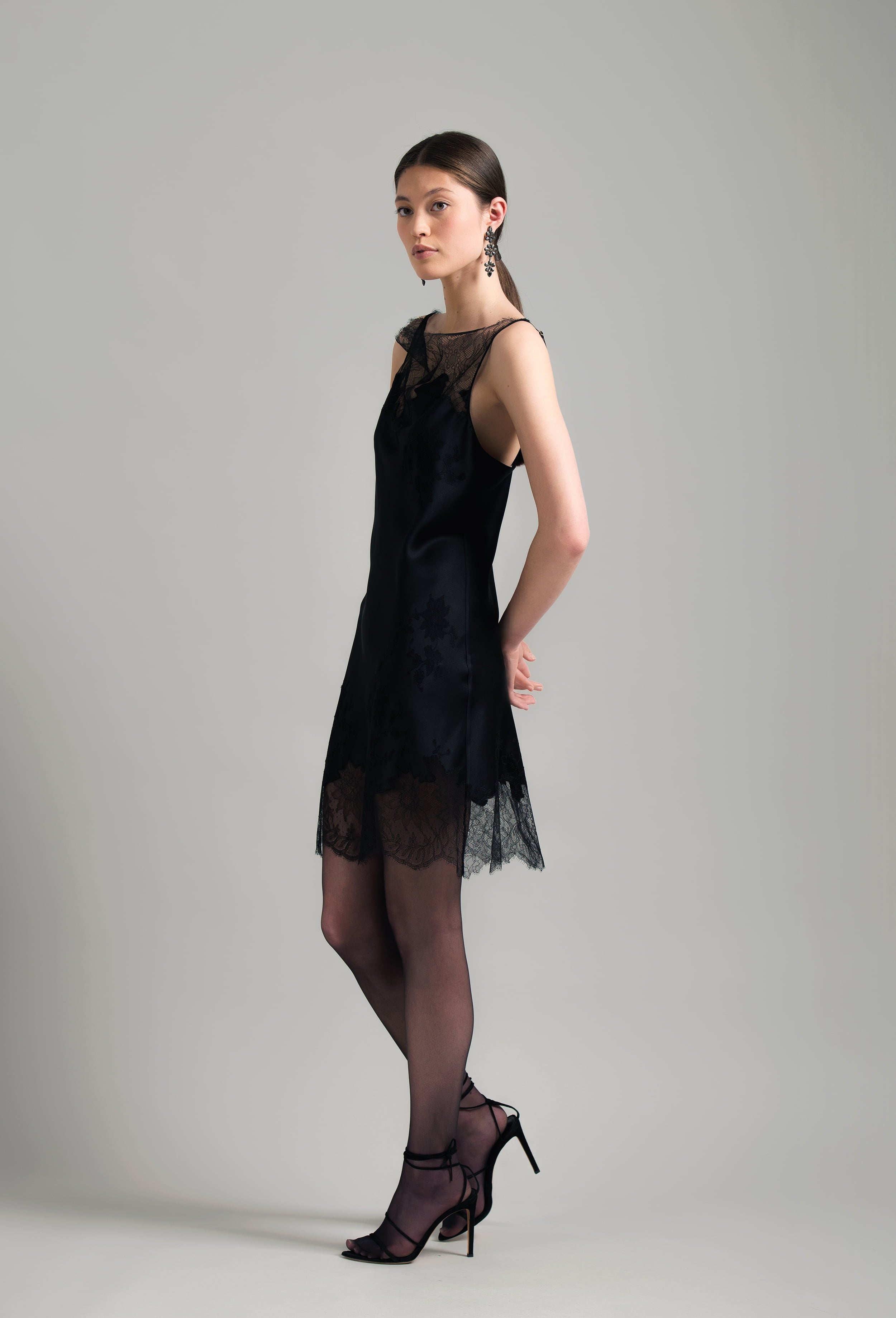 The Winter 2026-27 collection from the house Carine Gilson - The most beautiful couture lingerie to be discovered with this Midi dress with Cowl Neckline with lace in Black Silk  with Black lace