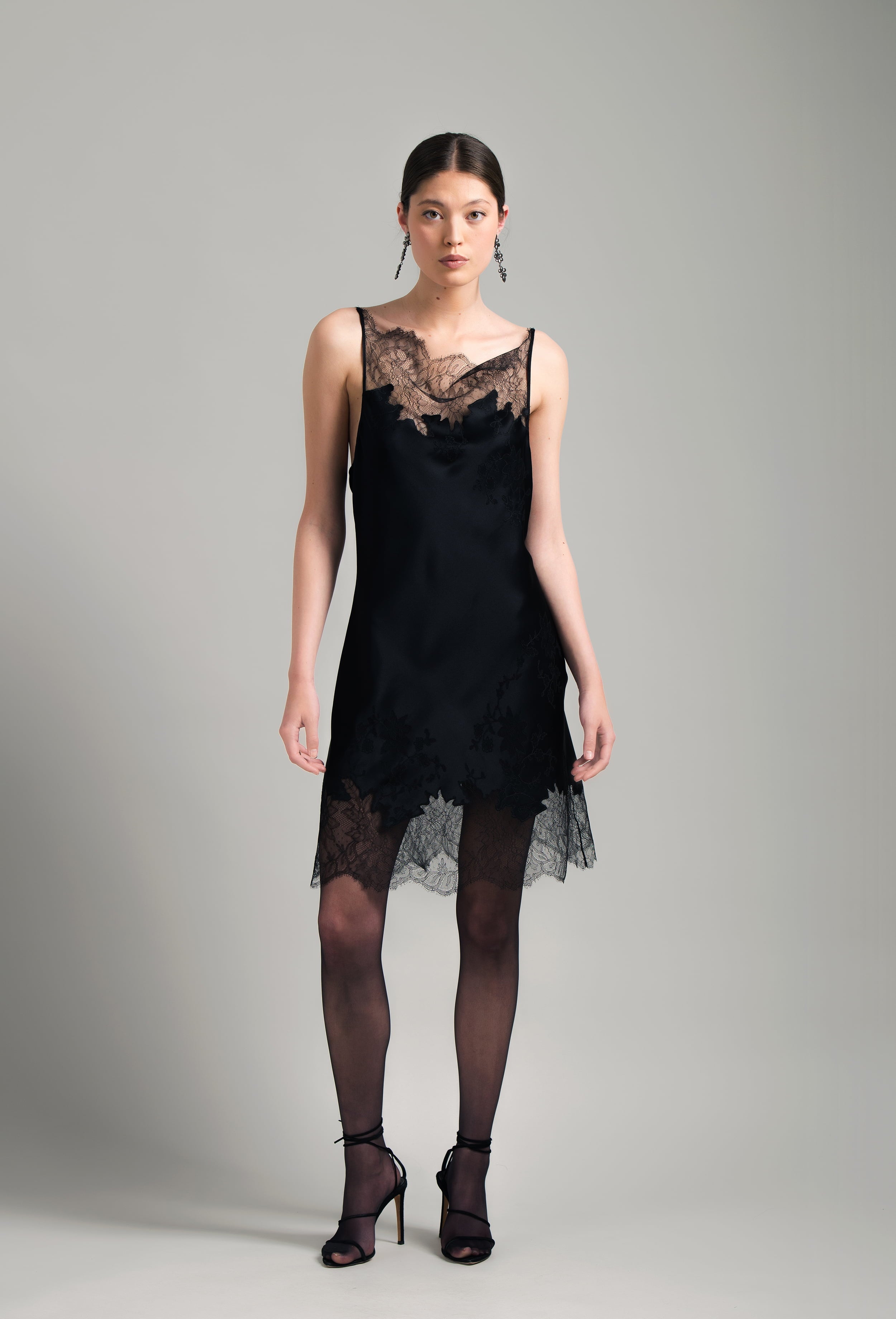 The Winter 2026-27 collection from the house Carine Gilson - The most beautiful couture lingerie to be discovered with this Midi dress with Cowl Neckline with lace in Black Silk  with Black lace