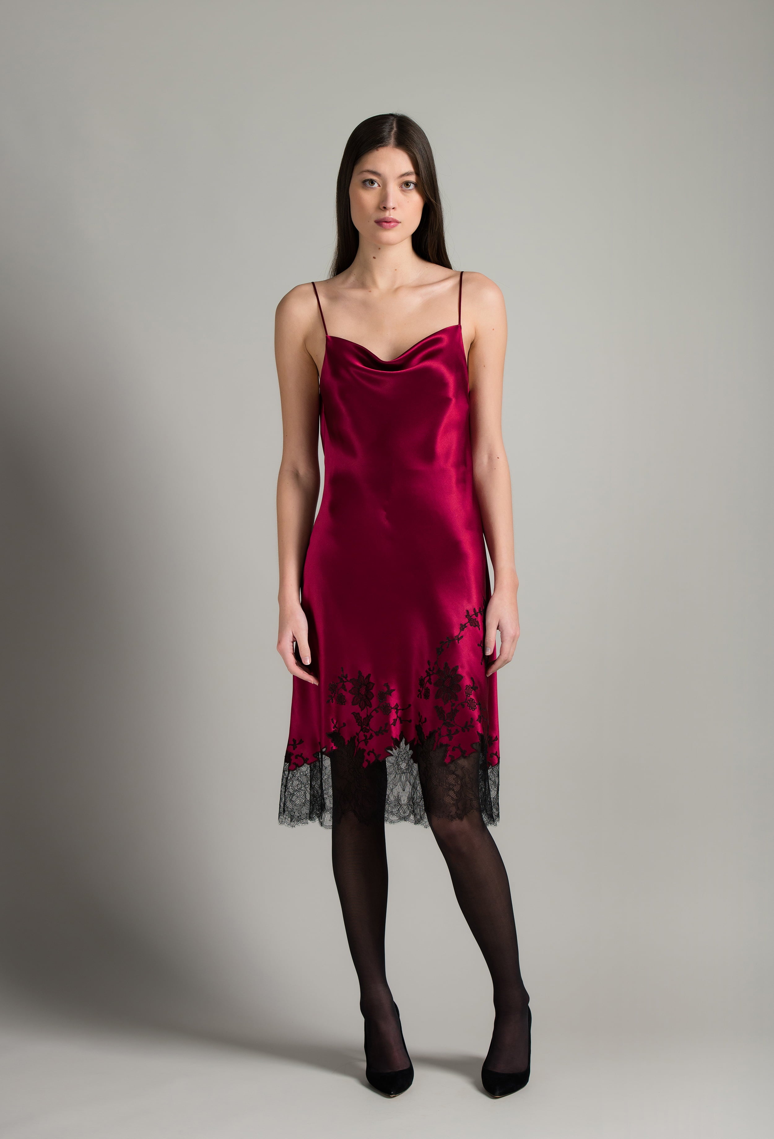 Discover the unique craftmanship of the belgian designer Carine Gilson in her atelier for the Winter 2026-27 collection with this Midi Dress with Scoop Neckline in Rubis red Silk  with Black lace