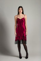 Discover the unique craftmanship of the belgian designer Carine Gilson in her atelier for the Winter 2026-27 collection with this Midi Dress with Scoop Neckline in Rubis red Silk  with Black lace