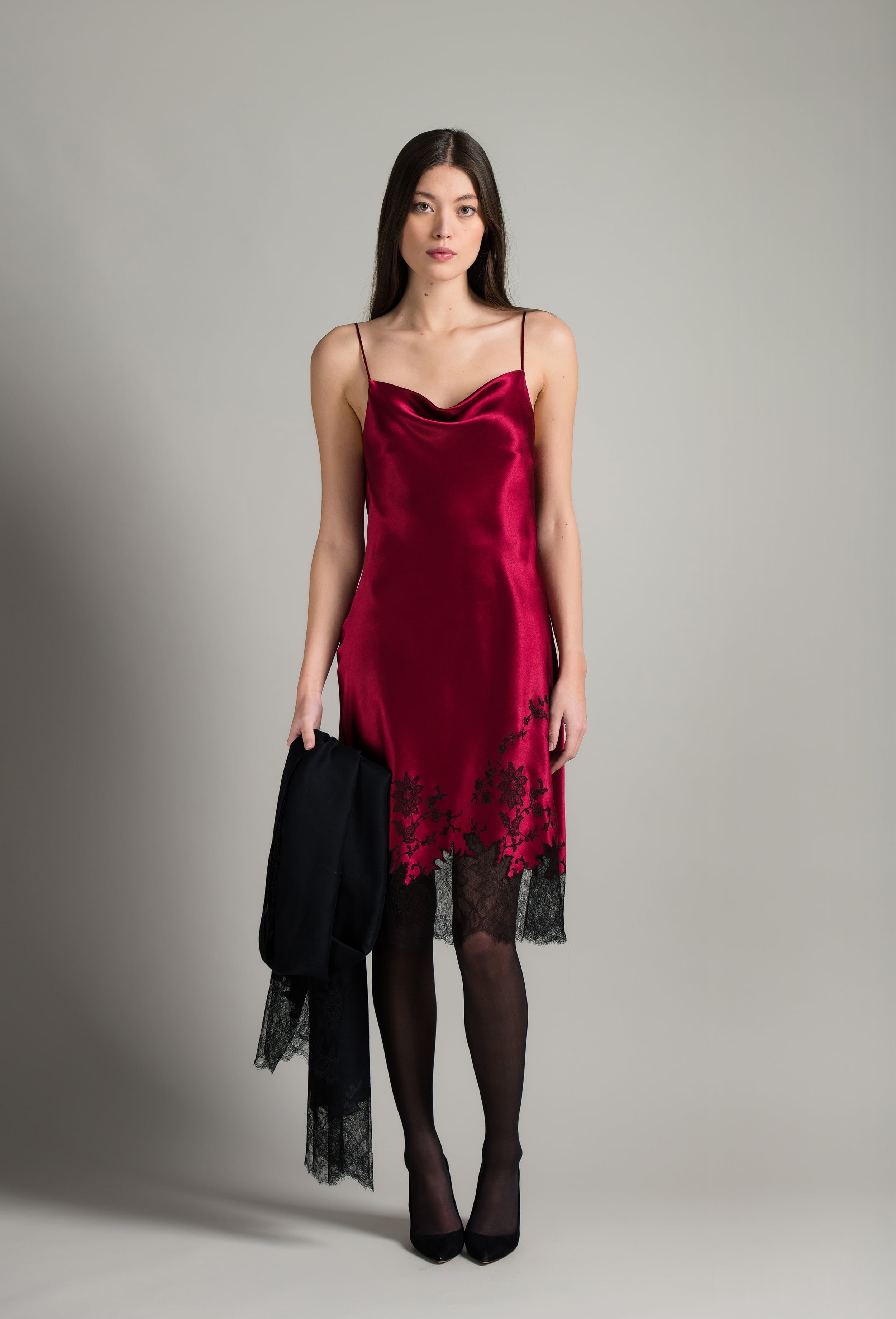 Discover the unique craftmanship of the belgian designer Carine Gilson in her atelier for the Winter 2026-27 collection with this Midi Dress with Scoop Neckline in Rubis red Silk  with Black lace
