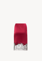 Discover the unique craftmanship of the belgian designer Carine Gilson in her atelier for the Winter 2026-27 collection with this Straight Skirt in Rubis red Silk  with Black lace