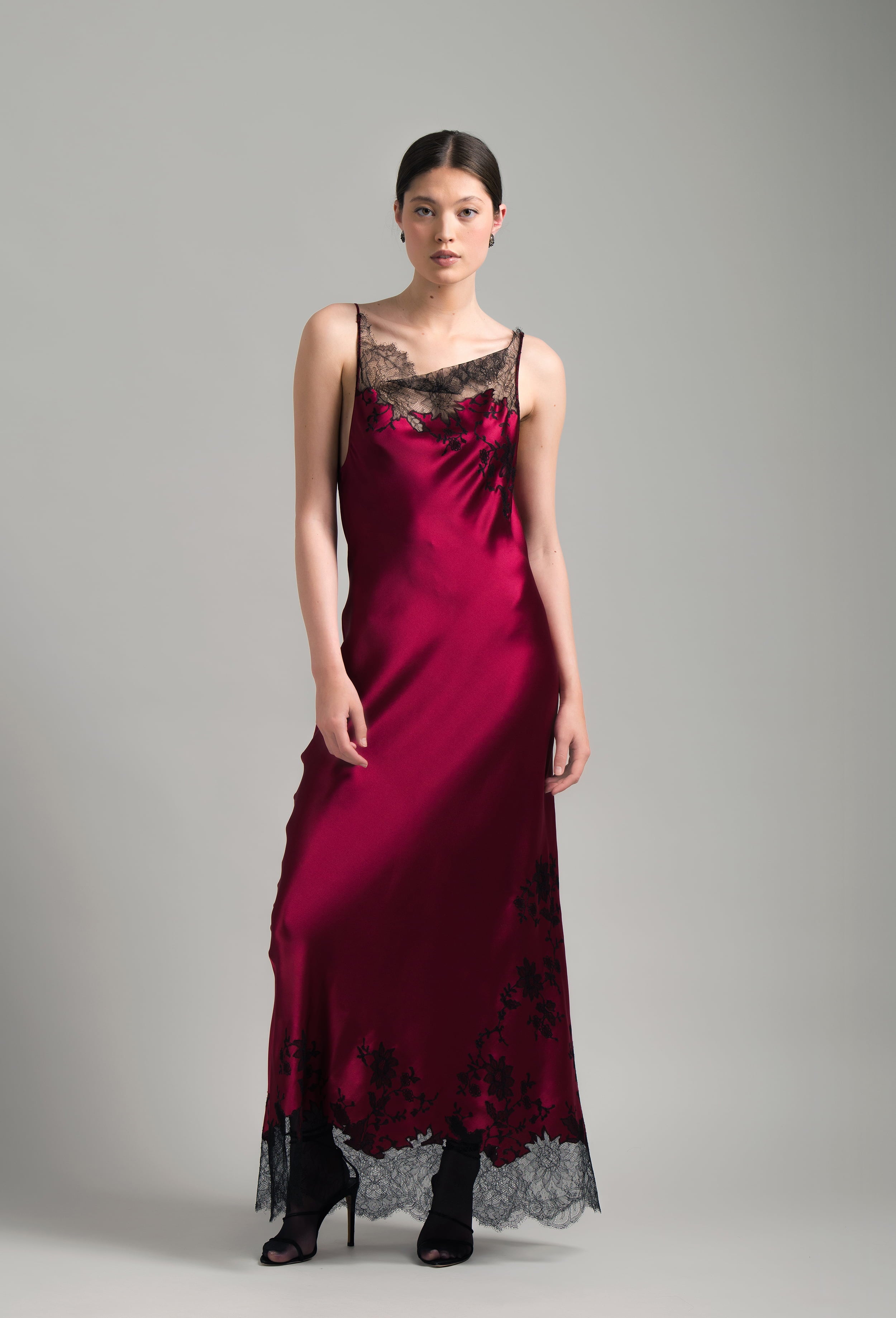 The Winter 2026-27 collection from the house Carine Gilson - The most beautiful couture lingerie to be discovered with this Long Dress Cowl Neckline with lace in Rubis red Silk  with Black lace