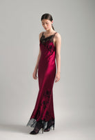 The Winter 2026-27 collection from the house Carine Gilson - The most beautiful couture lingerie to be discovered with this Long Dress Cowl Neckline with lace in Rubis red Silk  with Black lace