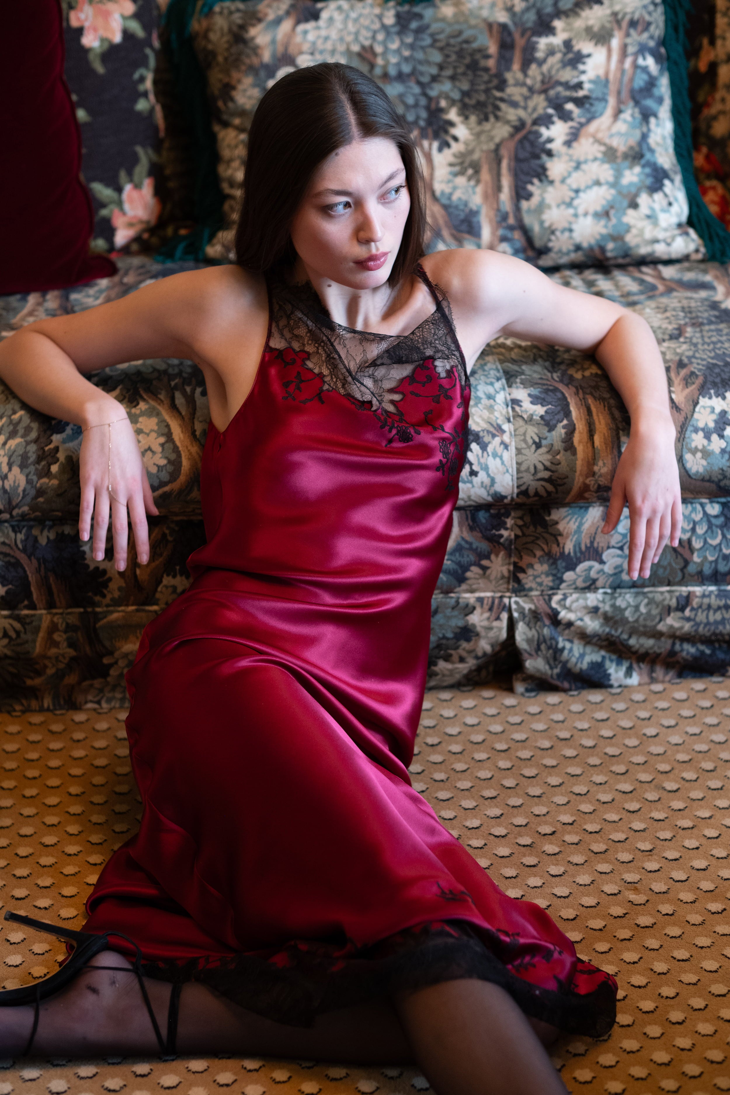 The Winter 2026-27 collection from the house Carine Gilson - The most beautiful couture lingerie to be discovered with this Long Dress Cowl Neckline with lace in Rubis red Silk  with Black lace