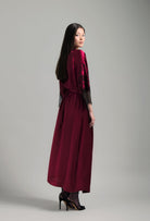 Discover the unique craftmanship of the belgian designer Carine Gilson in her atelier for the Winter 2026-27 collection with this Long Kimono Raglan Style in Rubis red Silk  with Black lace