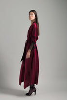 Discover the unique craftmanship of the belgian designer Carine Gilson in her atelier for the Winter 2026-27 collection with this Long Kimono Raglan Style in Rubis red Silk  with Black lace