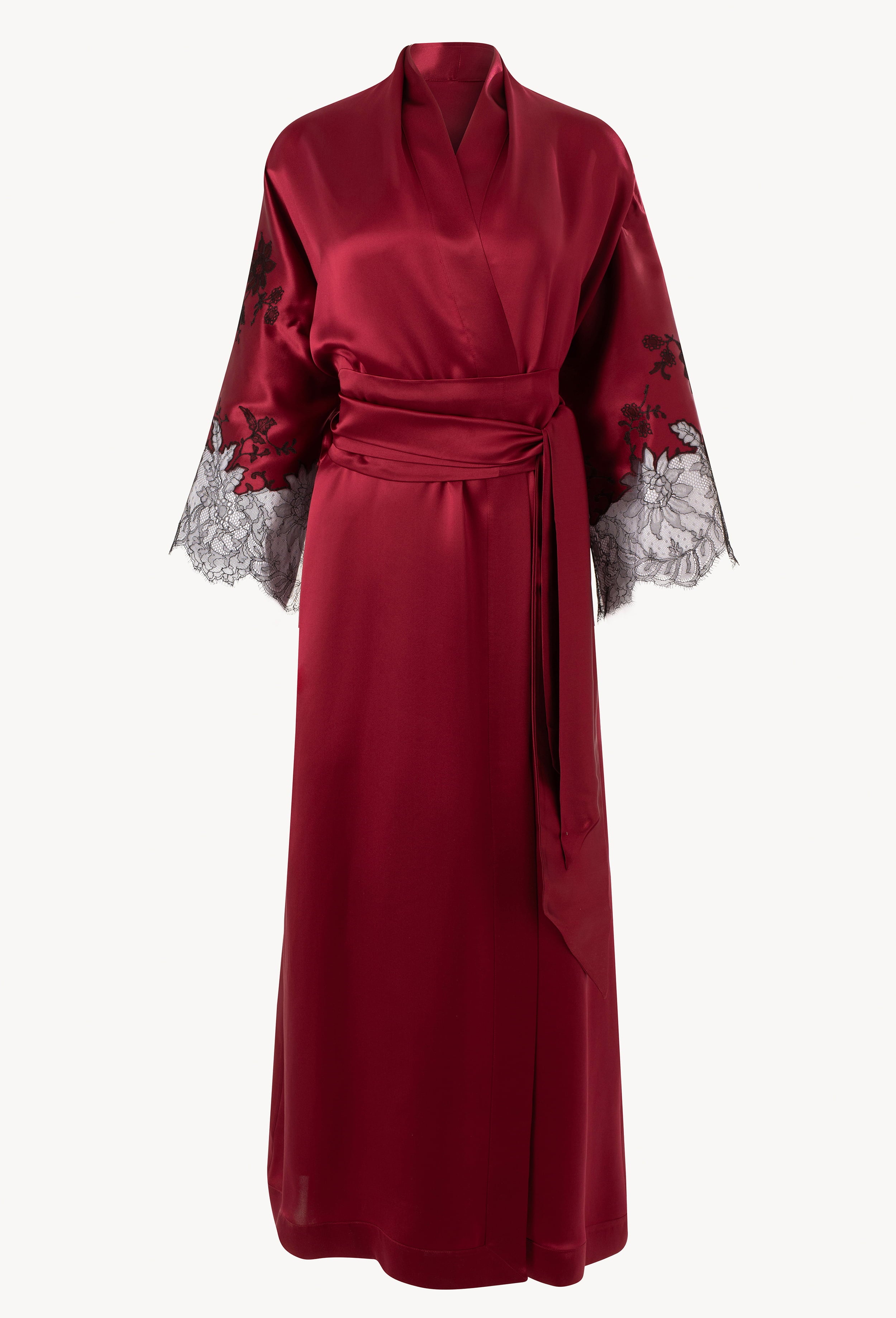 Discover the unique craftmanship of the belgian designer Carine Gilson in her atelier for the Winter 2026-27 collection with this Long Kimono Raglan Style in Rubis red Silk  with Black lace