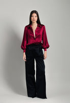Discover the unique craftmanship of the belgian designer Carine Gilson in her atelier for the Winter 2026-27 collection with this Shirt With Balloon Sleeves in Rubis red Silk 