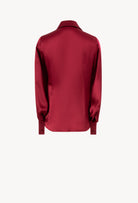 Discover the unique craftmanship of the belgian designer Carine Gilson in her atelier for the Winter 2026-27 collection with this Shirt With Balloon Sleeves in Rubis red Silk 