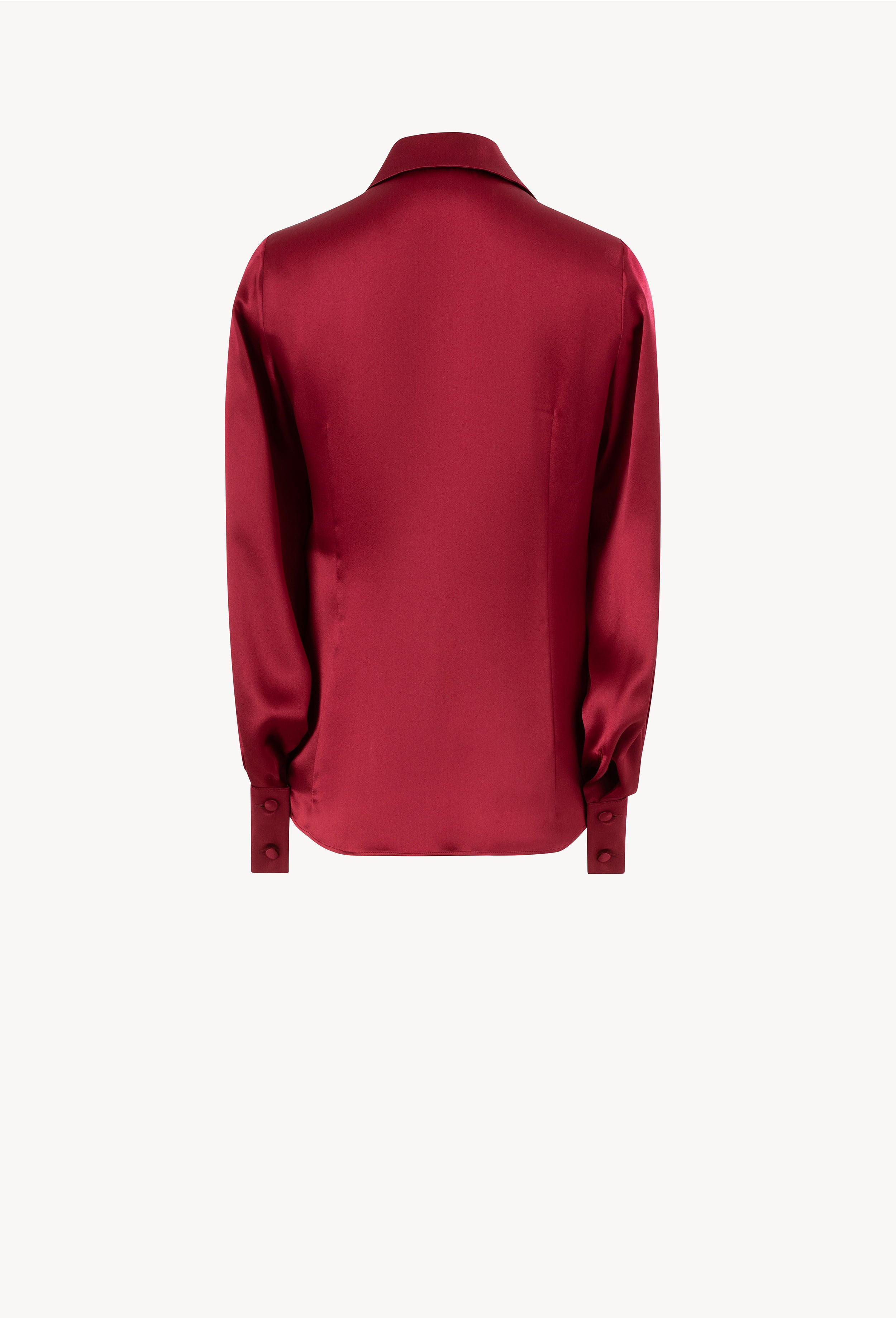 Discover the unique craftmanship of the belgian designer Carine Gilson in her atelier for the Winter 2026-27 collection with this Shirt With Balloon Sleeves in Rubis red Silk 