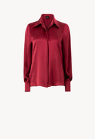 Discover the unique craftmanship of the belgian designer Carine Gilson in her atelier for the Winter 2026-27 collection with this Shirt With Balloon Sleeves in Rubis red Silk 