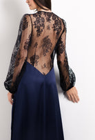 Discover the unique craftmanship of the belgian designer Carine Gilson in her atelier for the 2026 Cruise collection with this Long Déshabillé Cache-Coeur Style Silk Satin in Dark Marine Blue Silk  with black lace