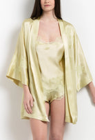 Enjoy the 2026 Summer collection of lingerie couture from the house Carine Gilson with this short kimono classic sleeves in light yellow silk with acid yellow lace
