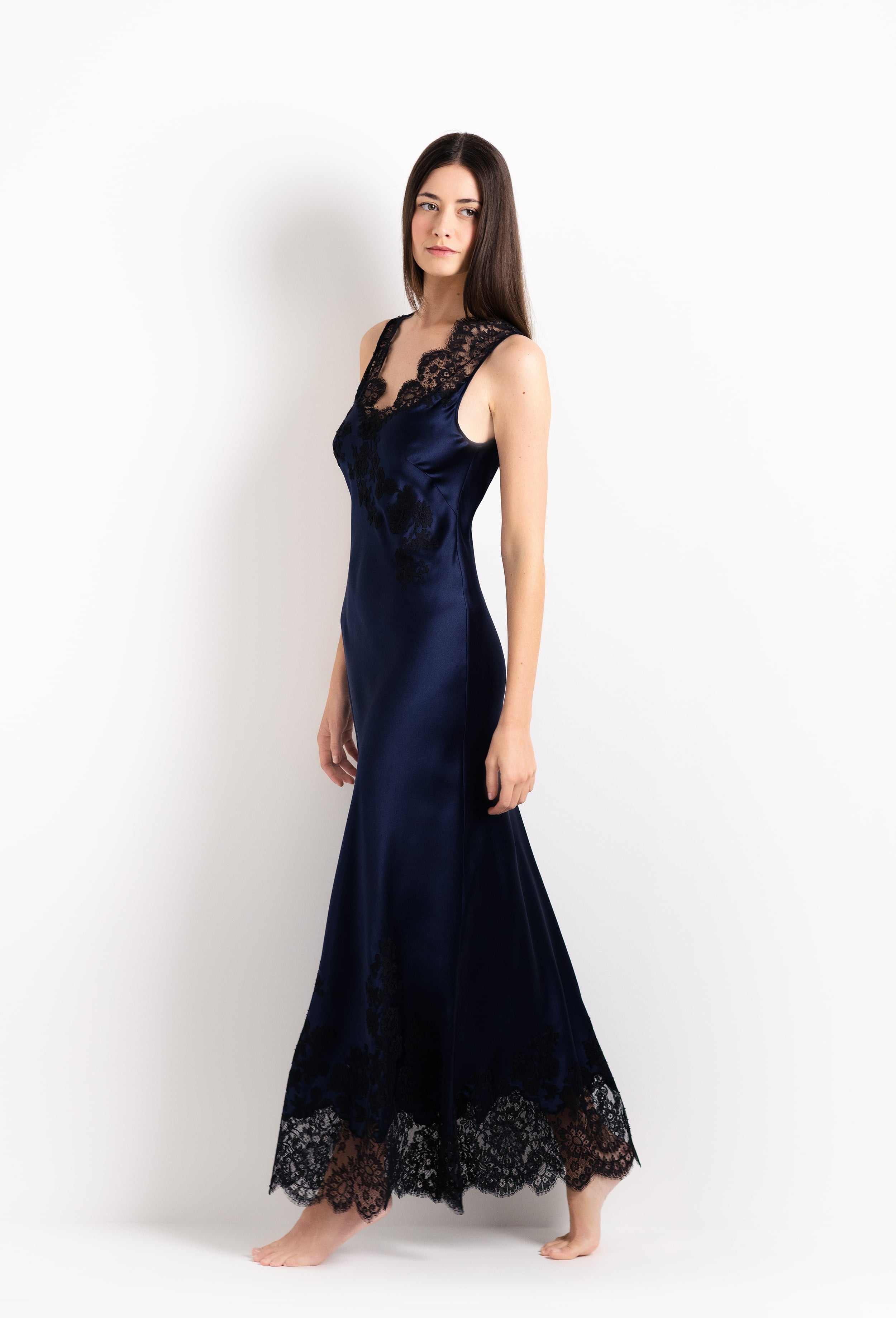 Enjoy the 2026 Cruise collection from the house Carine Gilson with this Long Gown V Neckline in Dark Marine Blue Silk  with black lace