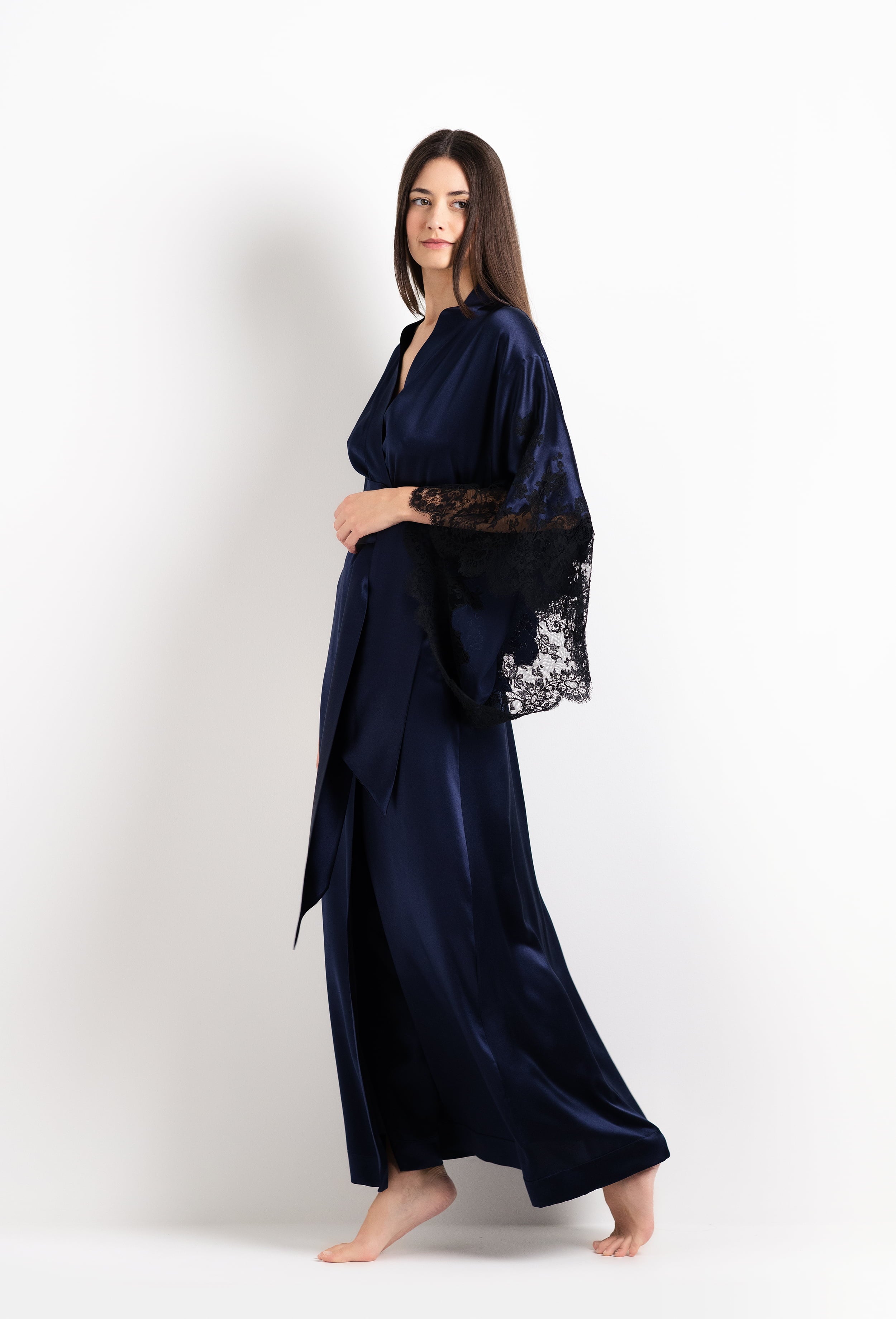 Discover the 2026 Cruise collection of silk and lace couture from the house Carine Gilson with this Long Kimono Butterfly Sleeves in Dark Marine Blue Silk  with black lace