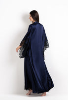Discover the 2026 Cruise collection of silk and lace couture from the house Carine Gilson with this Long Kimono Butterfly Sleeves in Dark Marine Blue Silk  with black lace