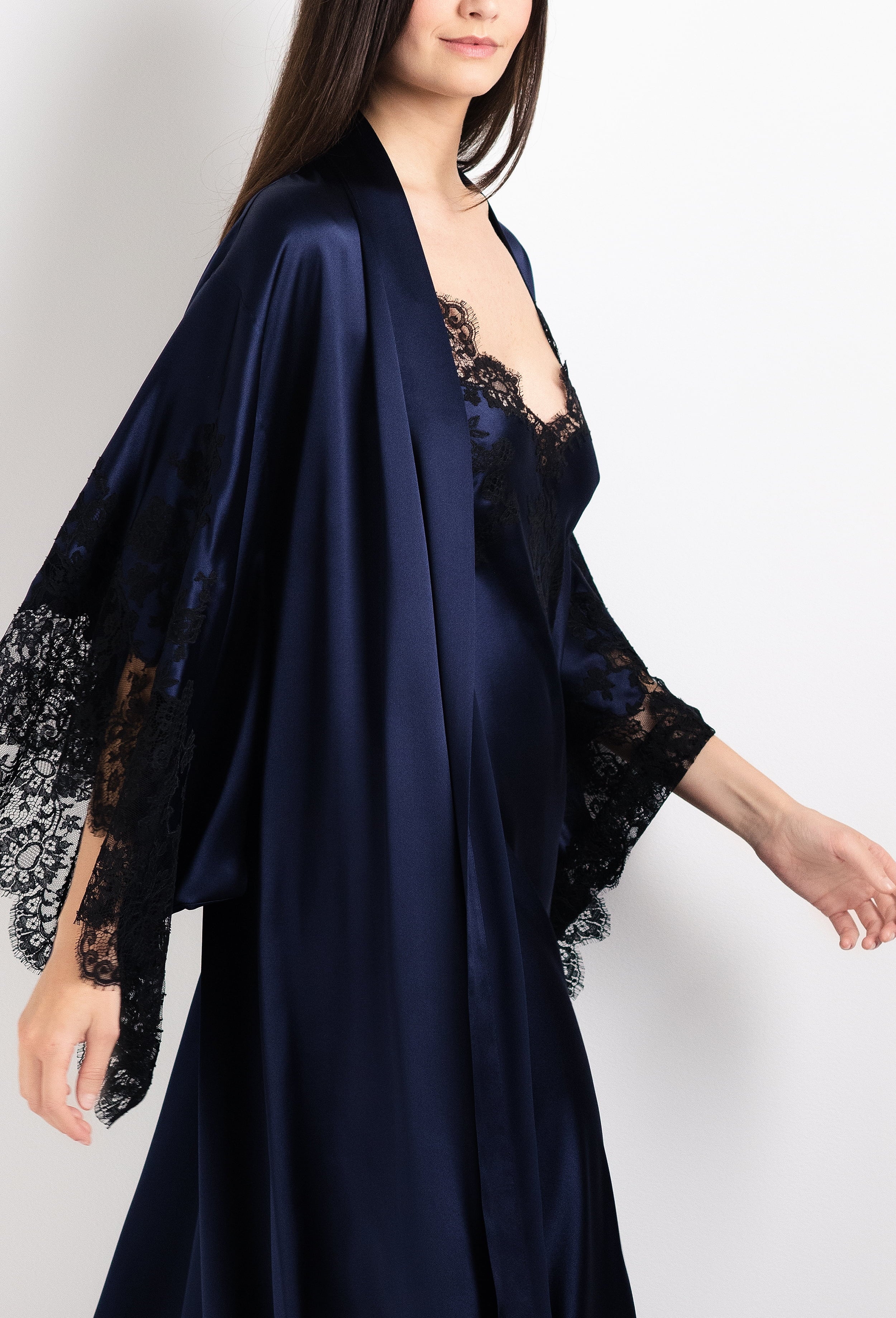 Discover the 2026 Cruise collection of silk and lace couture from the house Carine Gilson with this Long Kimono Butterfly Sleeves in Dark Marine Blue Silk  with black lace