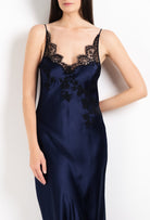 Made of silk and lace, explore the 2026 Cruise collection  from the house Carine Gilson with this Long Gown V Neckline in Dark Marine Blue Silk  with black lace