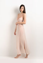 Discover the unique craftmanship of the belgian designer Carine Gilson in her atelier for the 2025 Summer collection with this Long Gown V Neckline in powder pink Silk  with light rose lace