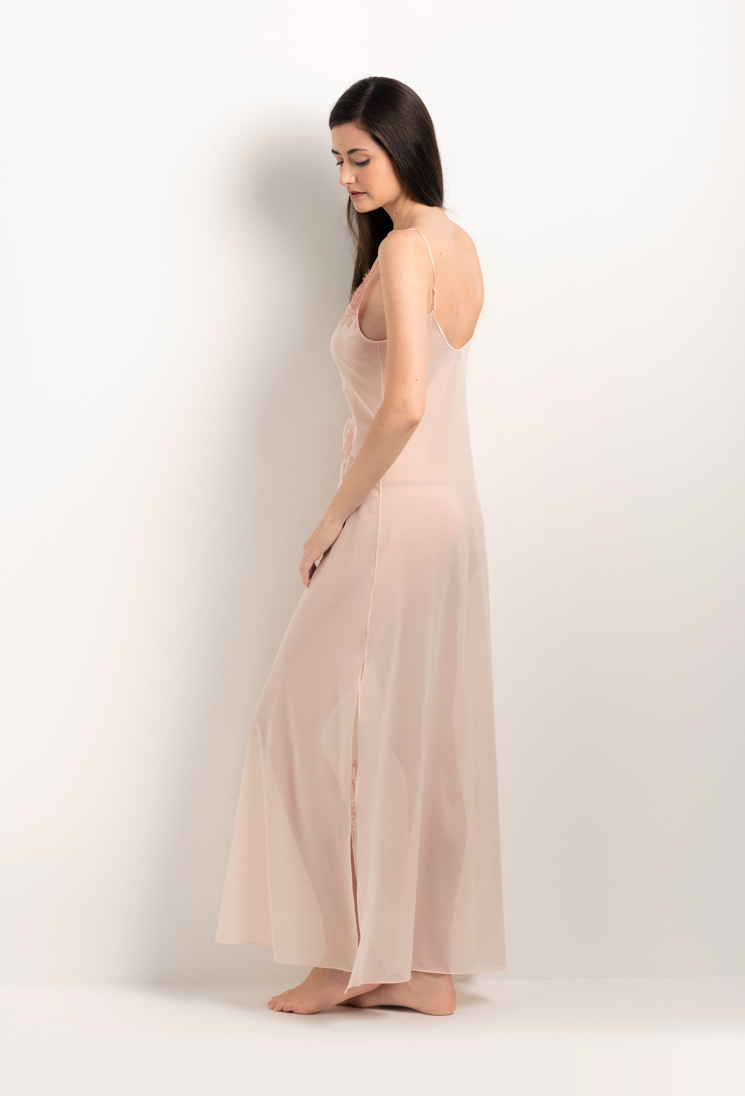 Discover the unique craftmanship of the belgian designer Carine Gilson in her atelier for the 2025 Summer collection with this Long Gown V Neckline in powder pink Silk  with light rose lace