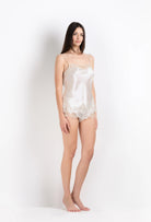 Enjoy the 2026 Summer collection of lingerie couture from the house Carine Gilson with this camisole straight neckline in ivory silk  with ivory lace