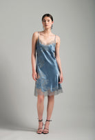 Enter Carine Gilson's world and the most beautiful silk lingerie with the Hiver 2026-27 collection with this Midi dress Classic Neckline in Blue stone Silk  with Grey lace
