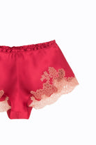 Discover the 2023 summer collection from the house Carine Gilson with this Floaty Shorts in bright red Silk with dusty pink lace