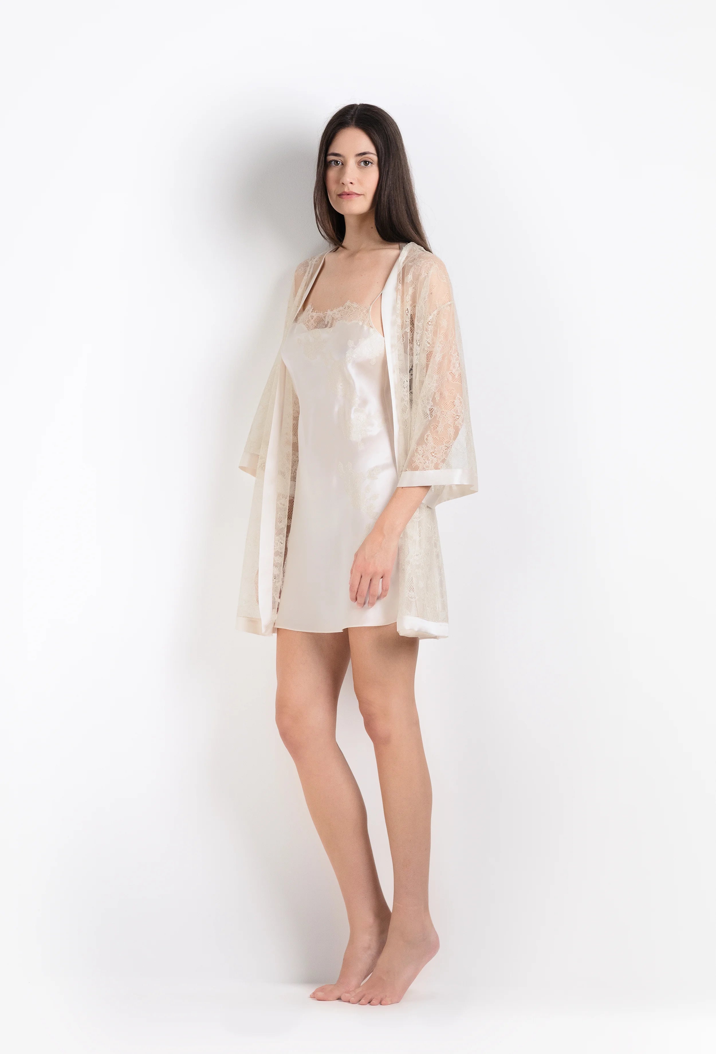 Made of silk and lace, explore 2026 Summer collection from the house Carine Gilson with this slip babydoll style straight neckline in ivory silk  with ivory lace