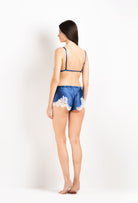 Discover the unique craftmanship of the belgian designer Carine Gilson in her atelier for the 2026 Cruise collection with this Soft Triangle Bra in Azur Silk  with Natural lace