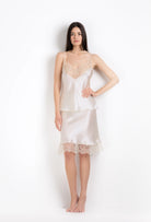 Discover the unique craftmanship of the belgian designer Carine Gilson in her atelier for the 2026 Summer collection with this camisole classic in ivory silk  with ivory lace