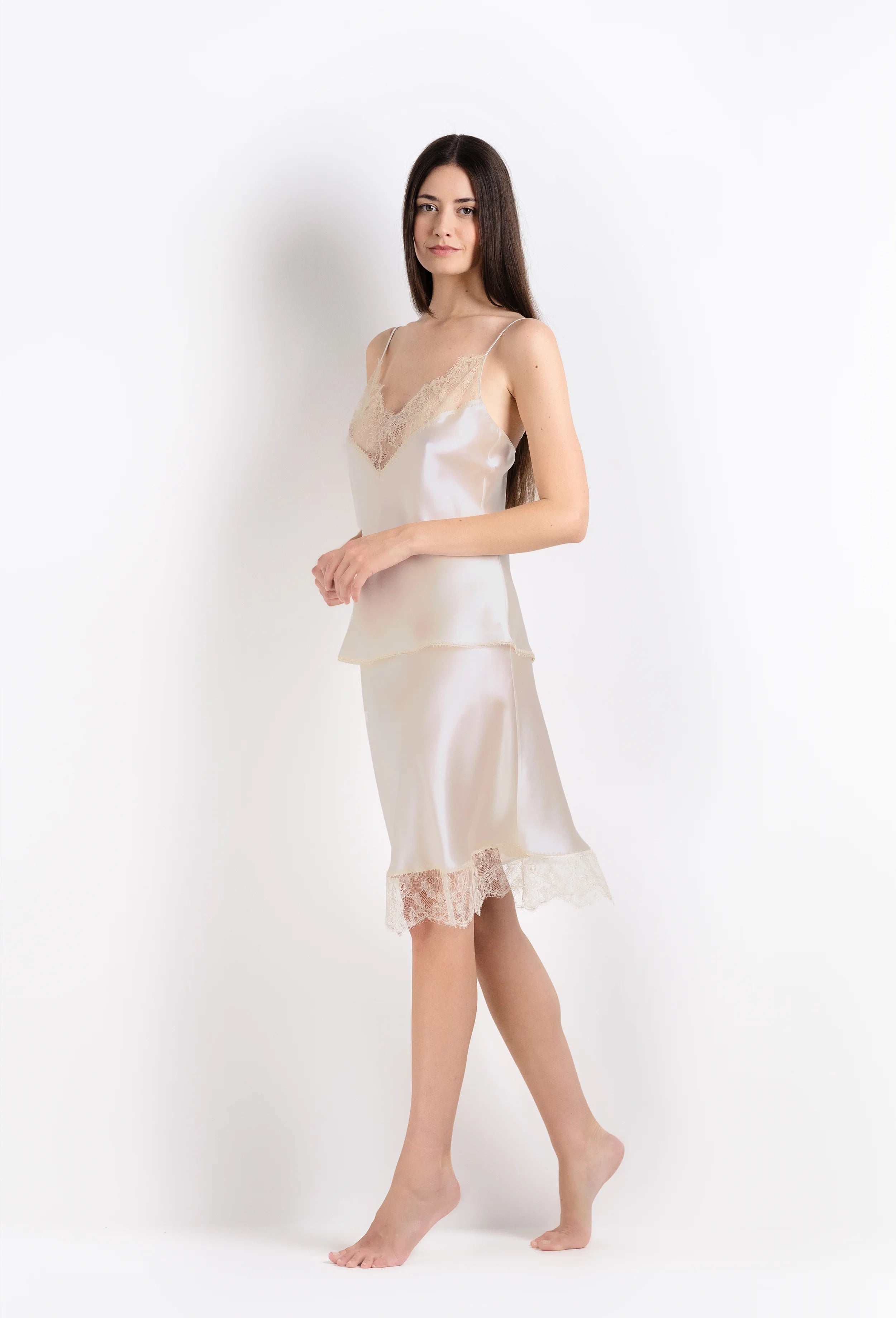 Discover the unique craftmanship of the belgian designer Carine Gilson in her atelier for the 2026 Summer collection with this camisole classic in ivory silk  with ivory lace