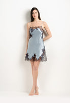 Discover the unique craftmanship of the belgian designer Carine Gilson in her atelier for the 2025 Winter collection with this Slip Straight Neckline in Frozen blue Silk  with Ebony lace