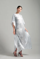The Hiver 2026-27 collection from the house Carine Gilson - The most beautiful couture lingerie to be discovered with this Long Kaftan Dress with 2 Silk Carre in Silver print Silk 