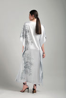 The Hiver 2026-27 collection from the house Carine Gilson - The most beautiful couture lingerie to be discovered with this Long Kaftan Dress with 2 Silk Carre in Silver print Silk 