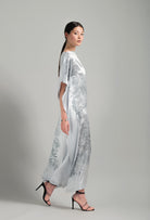 The Hiver 2026-27 collection from the house Carine Gilson - The most beautiful couture lingerie to be discovered with this Long Kaftan Dress with 2 Silk Carre in Silver print Silk 