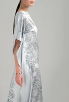 The Hiver 2026-27 collection from the house Carine Gilson - The most beautiful couture lingerie to be discovered with this Long Kaftan Dress with 2 Silk Carre in Silver print Silk 