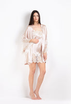 The 2026 Cruise collection from the house Carine Gilson - The most beautiful couture lingerie to be discovered with this slip babydoll style straight neckline in silverpink silk  with natural lace
