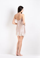 Made of silk and lace, explore the 2026 Cruise collection from the house Carine Gilson with this slip babydoll style v neckline in silverpink silk  with natural lace