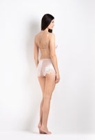 Discover the unique craftmanship of the belgian designer Carine Gilson in her atelier for the 2026 Cruise collection with this soft triangle bra in silverpink silk  with natural lace