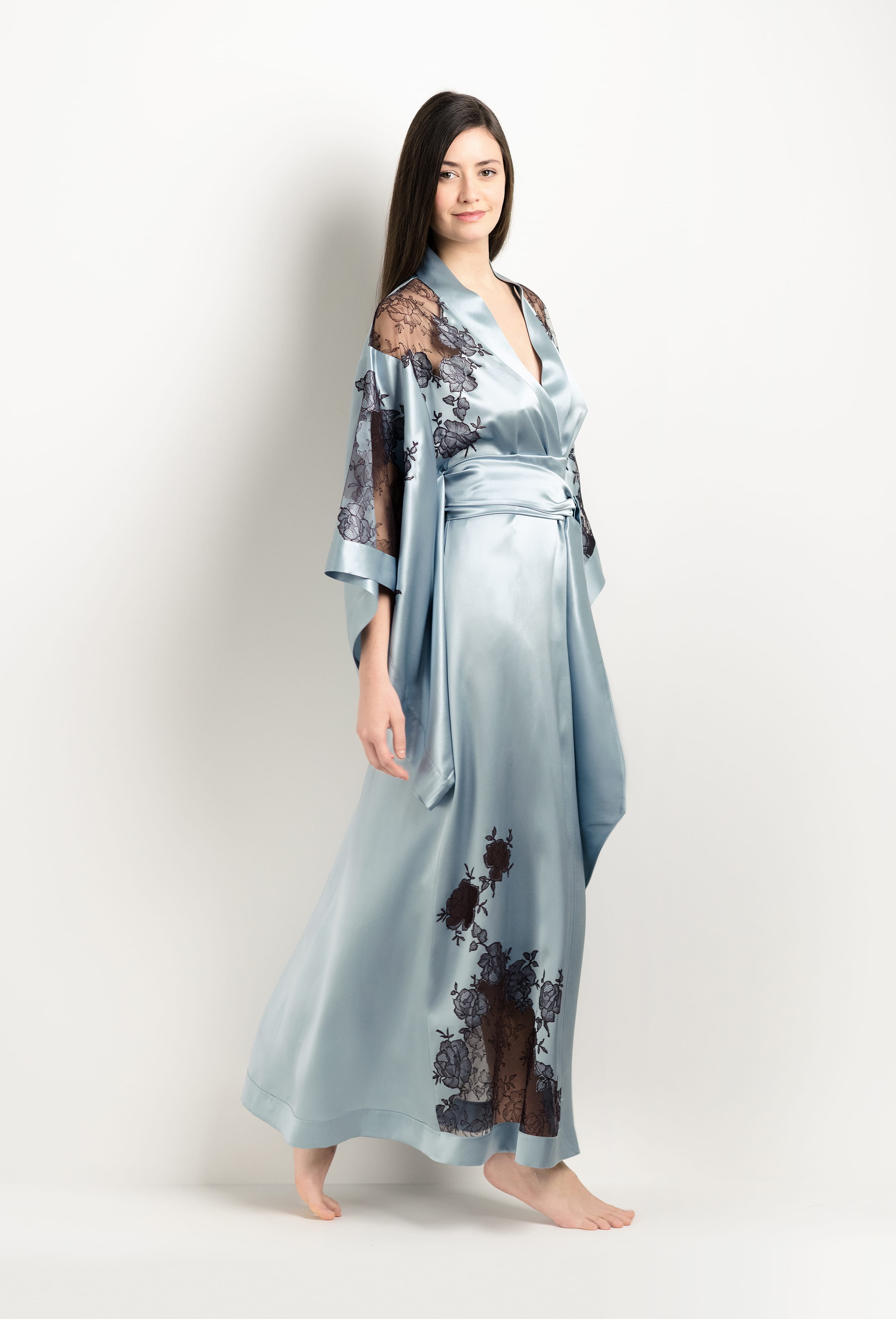 Discover the unique craftmanship of the belgian designer Carine Gilson in her atelier for the 2025 Winter collection with this Long Kimono Butterfly Sleeves in Frozen blue Silk  with Ebony lace