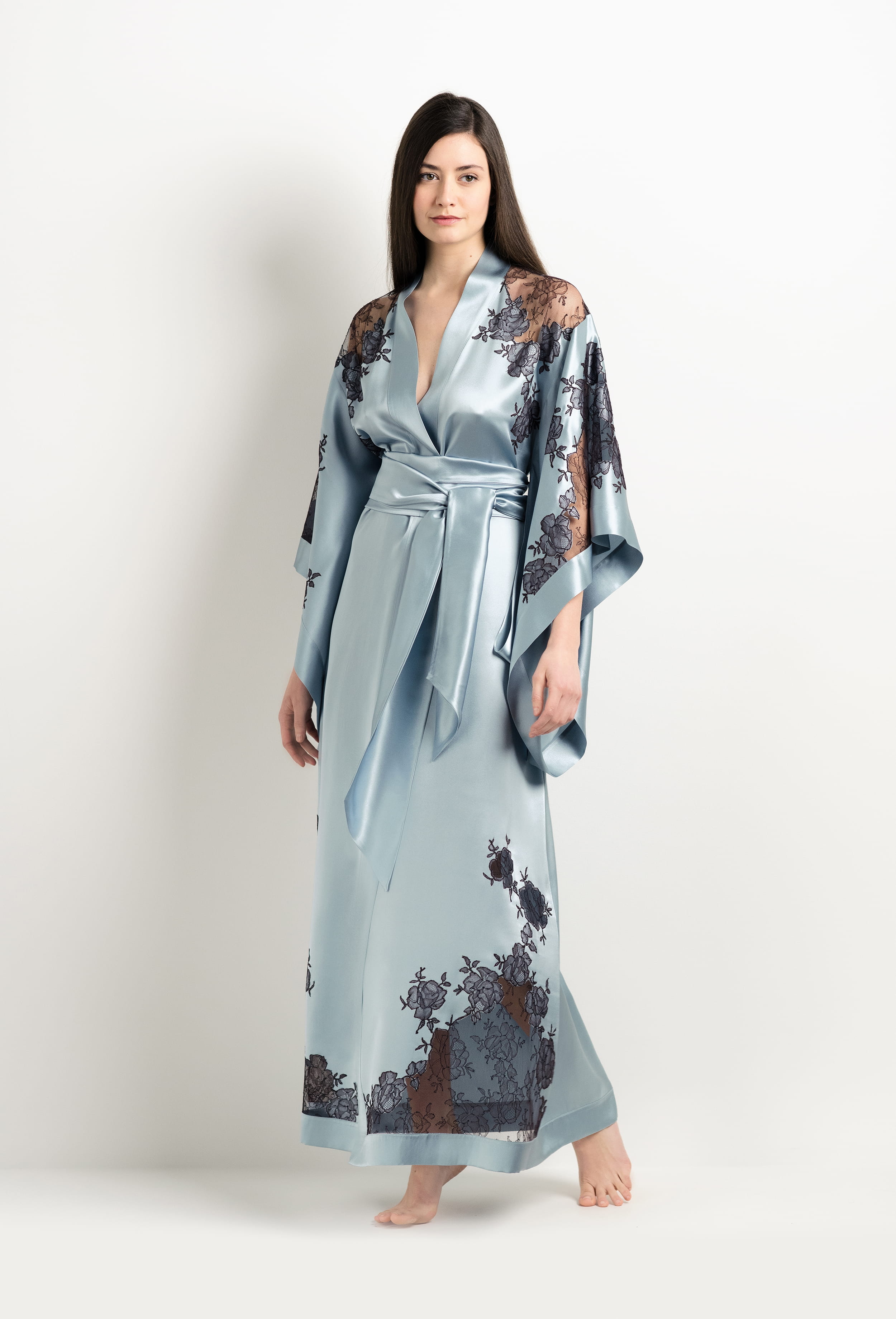Discover the unique craftmanship of the belgian designer Carine Gilson in her atelier for the 2025 Winter collection with this Long Kimono Butterfly Sleeves in Frozen blue Silk  with Ebony lace