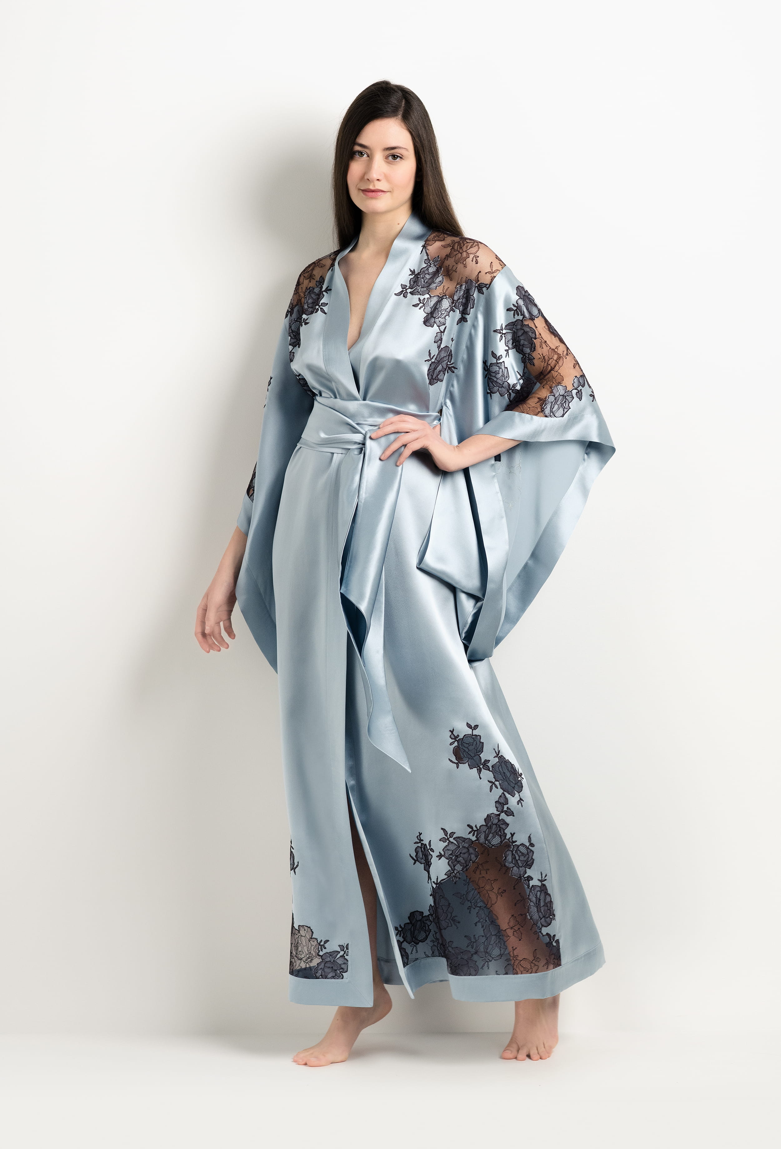 Discover the unique craftmanship of the belgian designer Carine Gilson in her atelier for the 2025 Winter collection with this Long Kimono Butterfly Sleeves in Frozen blue Silk  with Ebony lace