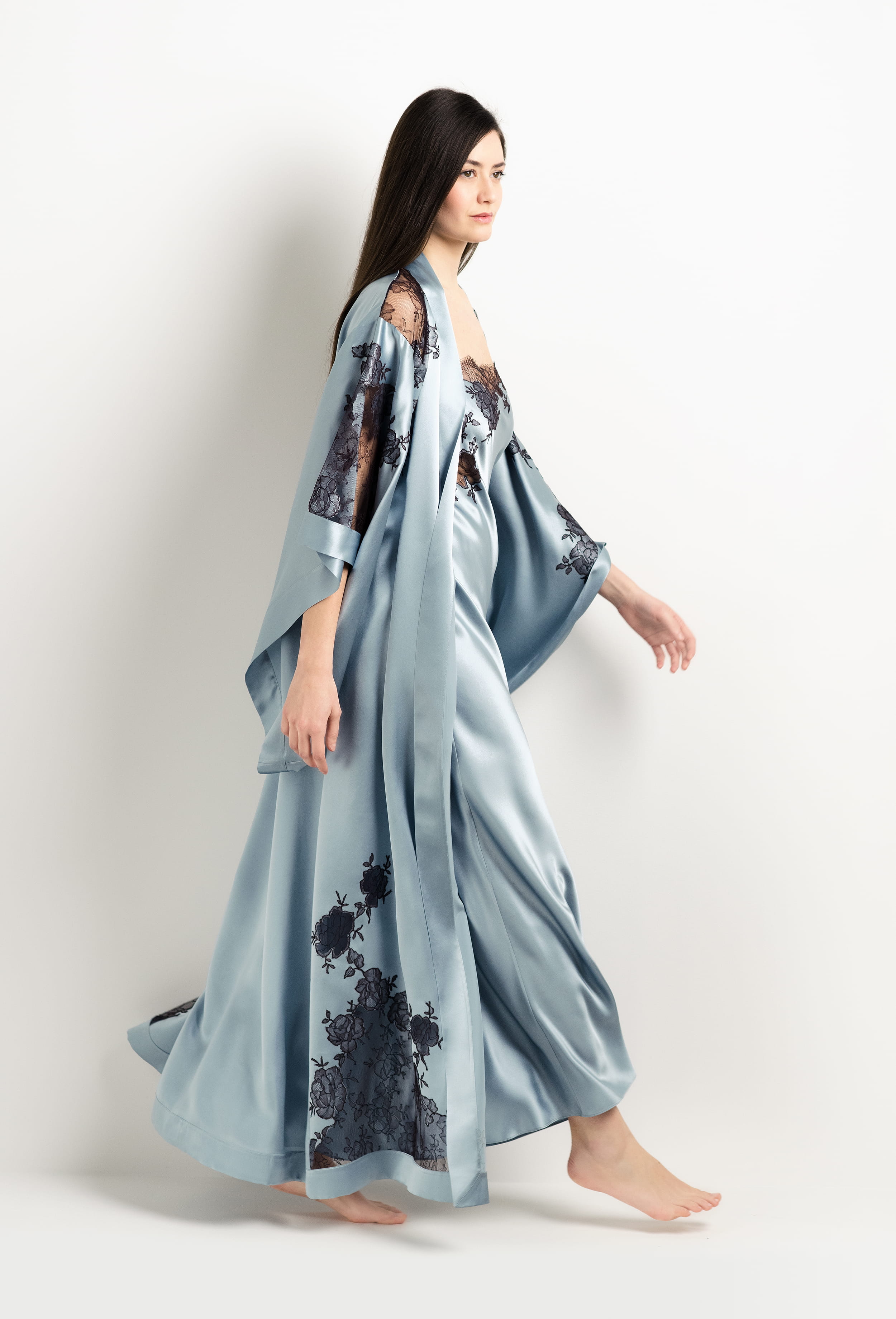 Discover the unique craftmanship of the belgian designer Carine Gilson in her atelier for the 2025 Winter collection with this Long Kimono Butterfly Sleeves in Frozen blue Silk  with Ebony lace