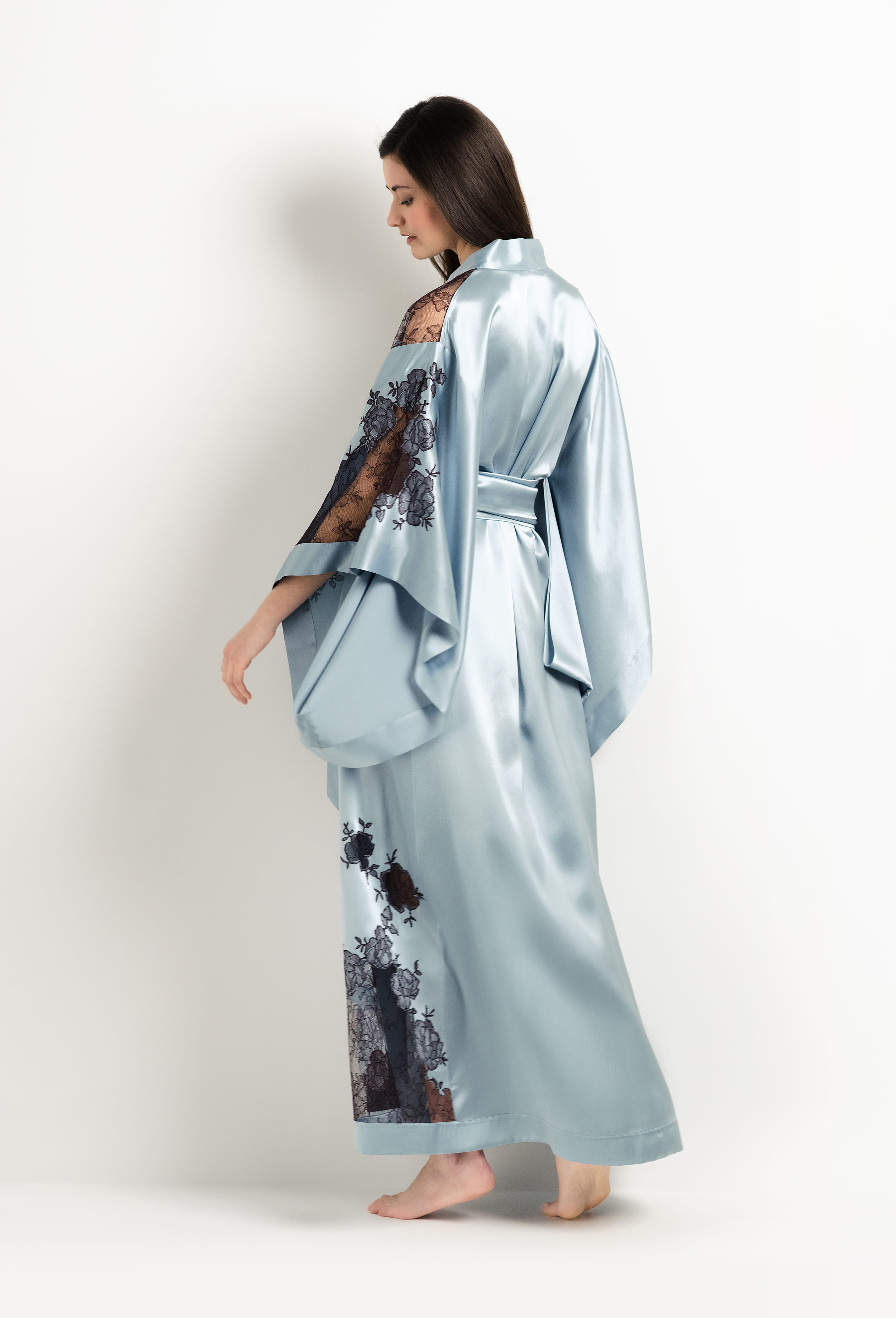 Discover the unique craftmanship of the belgian designer Carine Gilson in her atelier for the 2025 Winter collection with this Long Kimono Butterfly Sleeves in Frozen blue Silk  with Ebony lace