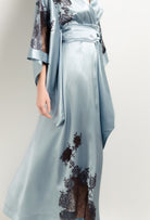 Discover the unique craftmanship of the belgian designer Carine Gilson in her atelier for the 2025 Winter collection with this Long Kimono Butterfly Sleeves in Frozen blue Silk  with Ebony lace