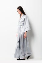 The Winter 2026-27 collection from the house Carine Gilson - The most beautiful couture loungewear to be discovered with this long kimono classic sleeves in Silver grey with contrast details