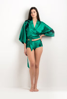 Discover the unique craftmanship of the belgian designer Carine Gilson in her atelier for the 2025 cruise collection with this Kimono Style Cachecoeur Shirt in Jade Green Silk  with Black lace